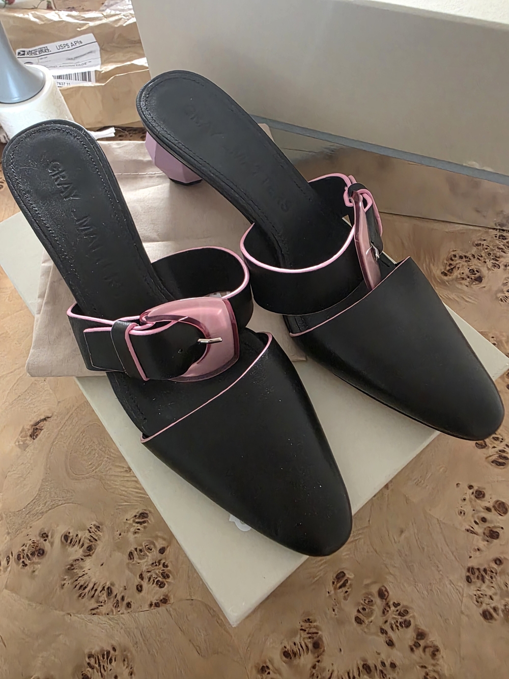 Gray Matters Black Pointed Mules with Pink Buckle & Trim